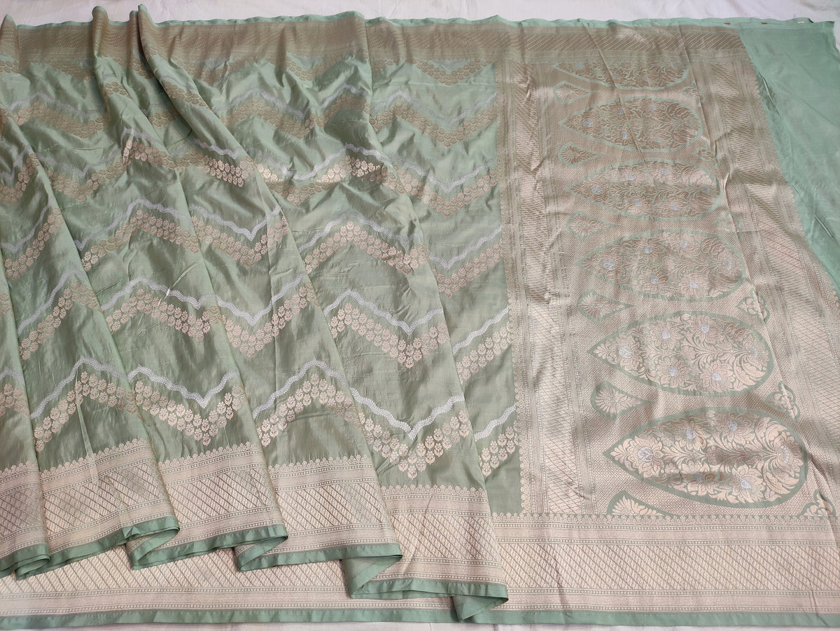 Banarasi Pure Katan Silk Pista Green Base Sarees Enhanced with Distinctive Sona Rupa Zig Zag Detailing