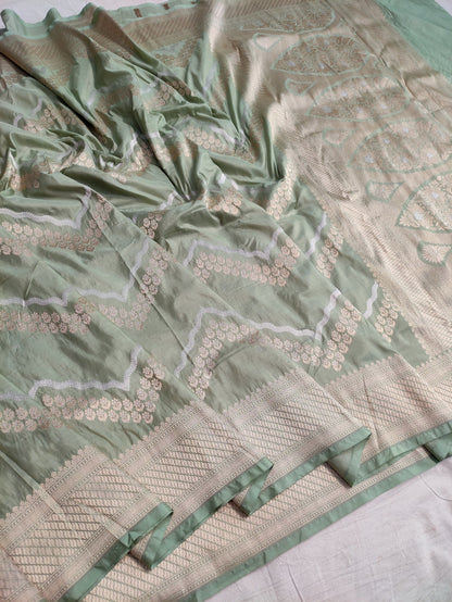 Banarasi Pure Katan Silk Pista Green Base Sarees Enhanced with Distinctive Sona Rupa Zig Zag Detailing