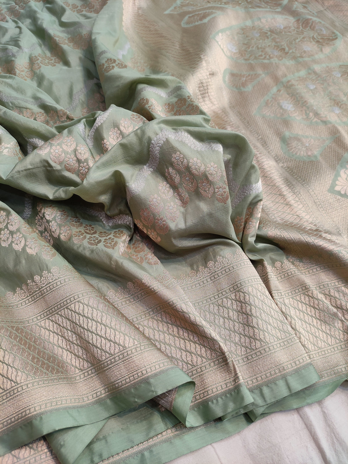 Banarasi Pure Katan Silk Pista Green Base Sarees Enhanced with Distinctive Sona Rupa Zig Zag Detailing